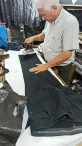 Zohar at work in his tailor shop
